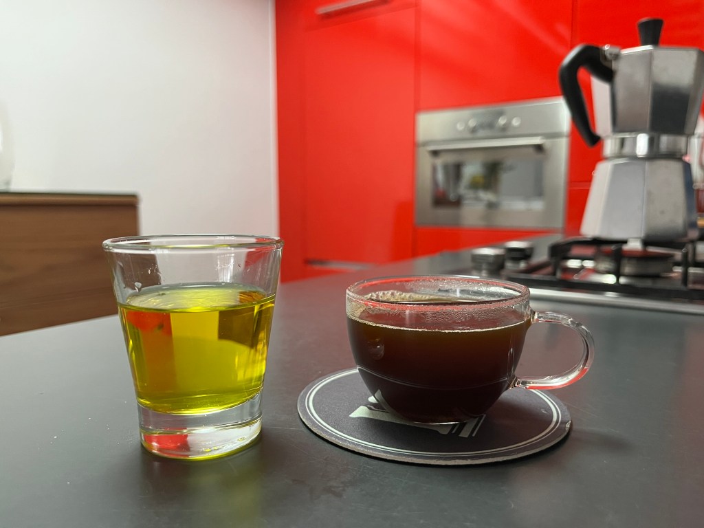 Spanish licor de hierbas served alongside a fresh espresso, a classic after-dinner pairing